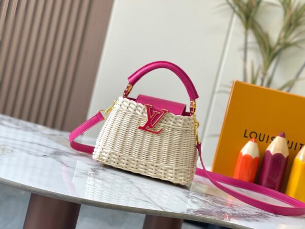 This Capucines mini handbag is crafted with a unique woven design made of rattan.